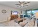 Open-concept living room with a sliding glass door leading to the lanai at 7116 Estero Ct, Apollo Beach, FL 33572
