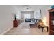 Bright living room with a ceiling fan, modern furniture, and wood-look flooring at 7116 Estero Ct, Apollo Beach, FL 33572