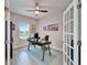 Bright home office with a modern desk, natural light, and French doors at 7116 Estero Ct, Apollo Beach, FL 33572