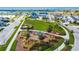 Community playground with colorful equipment, surrounded by green space and sidewalks at 7116 Estero Ct, Apollo Beach, FL 33572