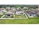 Aerial view of the fenced backyard, highlighting its size and relation to neighboring houses at 7509 Tangle Bend Dr, Gibsonton, FL 33534