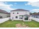 View of the home's backyard, featuring a well-maintained lawn and patio area perfect for relaxing at 7509 Tangle Bend Dr, Gibsonton, FL 33534
