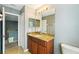 Half-bath vanity features a beautiful countertop, cabinet and decorative lighting at 7509 Tangle Bend Dr, Gibsonton, FL 33534