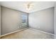 Neutral bedroom with a window that provides a view of the yard and lets in natural light at 7509 Tangle Bend Dr, Gibsonton, FL 33534
