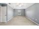 Spacious bedroom with neutral carpet, ceiling fan, and a bright window at 7509 Tangle Bend Dr, Gibsonton, FL 33534