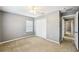 Bedroom with a ceiling fan and a closet, near an entryway to the rest of the home at 7509 Tangle Bend Dr, Gibsonton, FL 33534