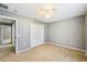 Spacious bedroom with a ceiling fan, closet, and doorway to other rooms of the house at 7509 Tangle Bend Dr, Gibsonton, FL 33534