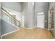 Spacious foyer with high ceilings, staircase, and tile flooring at 7509 Tangle Bend Dr, Gibsonton, FL 33534