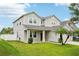 A charming home with a lush green lawn, complemented by two palm trees at 7509 Tangle Bend Dr, Gibsonton, FL 33534
