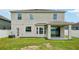 Rear exterior view of the home with patio at 7509 Tangle Bend Dr, Gibsonton, FL 33534