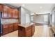 Open concept kitchen with granite countertops, wood cabinets, and an island at 7509 Tangle Bend Dr, Gibsonton, FL 33534