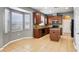 Eat-in kitchen features granite countertops, an island, and stainless steel appliances at 7509 Tangle Bend Dr, Gibsonton, FL 33534