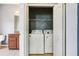 Laundry closet with washer and dryer in bathroom at 7509 Tangle Bend Dr, Gibsonton, FL 33534