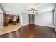 Living room showcases wood tile flooring and seamlessly connects to the adjacent kitchen at 7509 Tangle Bend Dr, Gibsonton, FL 33534