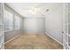 Office area with carpet floors, windows, and doors at 7509 Tangle Bend Dr, Gibsonton, FL 33534