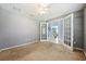 Office area with carpeted floors and stairway view at 7509 Tangle Bend Dr, Gibsonton, FL 33534