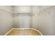 Spacious walk-in closet featuring white wire shelving for ample storage and organization at 7509 Tangle Bend Dr, Gibsonton, FL 33534