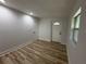 This room features wood-look floors and a door to the outside at 7703 Glenview Ln, Tampa, FL 33615
