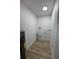 This is a utility room with hookups and wood-look floors at 7703 Glenview Ln, Tampa, FL 33615