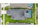 Bird's eye view of property featuring private screened-in pool, lawn, and fenced backyard at 8019 Marbella Creek Ave, Tampa, FL 33625
