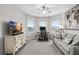 Versatile bedroom, perfect for a home office or den, featuring soft gray colors and plenty of natural light at 8019 Marbella Creek Ave, Tampa, FL 33625