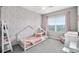 Charming bedroom with pink accents, soft carpet and abundant natural light at 8019 Marbella Creek Ave, Tampa, FL 33625
