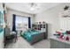 Comfortable bedroom with a study desk and fun decor at 8019 Marbella Creek Ave, Tampa, FL 33625