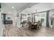 Bright dining area with wood floors, modern lighting, and elegant decor at 8019 Marbella Creek Ave, Tampa, FL 33625
