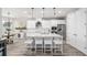 Bright, modern kitchen with white cabinets, quartz countertops, and center island seating at 8019 Marbella Creek Ave, Tampa, FL 33625