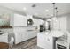 Bright, modern kitchen with white cabinets, stainless appliances, and a breakfast bar at 8019 Marbella Creek Ave, Tampa, FL 33625