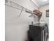 Laundry room featuring a modern washer and dryer set and metal storage shelves at 8019 Marbella Creek Ave, Tampa, FL 33625