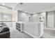 Cozy upstairs loft featuring neutral paint, plush carpet, and access to multiple rooms at 8019 Marbella Creek Ave, Tampa, FL 33625