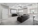 Upstairs loft area with comfortable seating, projector screen, and recessed lighting at 8019 Marbella Creek Ave, Tampa, FL 33625