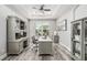 Comfortable home office with hardwood floors, lots of natural light, and custom built-ins at 8019 Marbella Creek Ave, Tampa, FL 33625