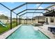 Beautiful backyard swimming pool and attached hot tub with splash fountains and lounge chairs at 8019 Marbella Creek Ave, Tampa, FL 33625