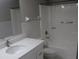 Bathroom featuring a white vanity, toilet, and a shower/tub combo at 8234 Ravencroft Dr, Tampa, FL 33615
