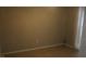 Empty room with tiled floors, neutral colored walls, a window and a door at 8234 Ravencroft Dr, Tampa, FL 33615