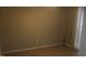 Empty room with tiled floors, neutral colored walls, a window and a door at 8234 Ravencroft Dr, Tampa, FL 33615