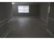 Spacious living room featuring neutral walls and tile flooring, offering a versatile living space at 8234 Ravencroft Dr, Tampa, FL 33615