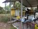 Backyard with a covered area and miscellaneous items at 8617 Broad St, New Port Richey, FL 34654