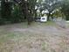 View of the property with a trailer and covered area at 8617 Broad St, New Port Richey, FL 34654