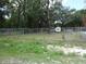 An expansive lot enclosed by fencing at 8617 Broad St, New Port Richey, FL 34654