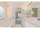Bathroom with double vanity, tub, and shower at 921 Linn Harbor Ct, Tarpon Springs, FL 34689
