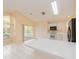 Bright kitchen featuring white cabinets, appliances, and a breakfast bar for casual dining at 921 Linn Harbor Ct, Tarpon Springs, FL 34689