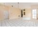 Open-concept living room featuring tile flooring and neutral walls, ready for personalization at 921 Linn Harbor Ct, Tarpon Springs, FL 34689