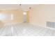 Bright living area with tile flooring, natural light and a view of the home's entrance at 921 Linn Harbor Ct, Tarpon Springs, FL 34689