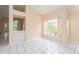 Inviting living room space with tile flooring and natural light, perfect for entertaining at 921 Linn Harbor Ct, Tarpon Springs, FL 34689