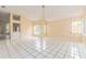 Bright, open-concept living room with tile flooring and large windows, bathed in natural light at 921 Linn Harbor Ct, Tarpon Springs, FL 34689