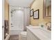Bright bathroom featuring a shower-tub combo, white vanity, and stylish mirror for a clean and relaxing space at 960 Starkey Rd # 7503, Largo, FL 33771