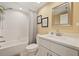 Well-lit bathroom with shower-tub combo, white vanity, and framed mirror, providing a clean and functional space at 960 Starkey Rd # 7503, Largo, FL 33771
